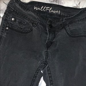 Plain pair of black jeans .